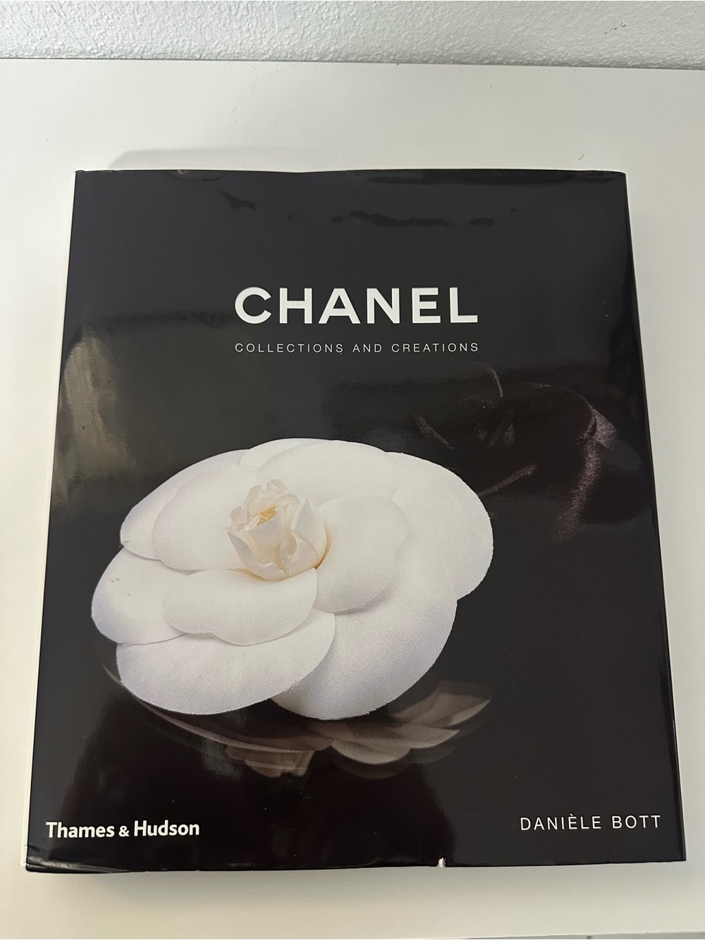 CHANEL Black Cover with White Camellia Motif